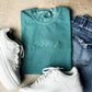 God Is Greater Than Highs & Lows Embroidered Tee